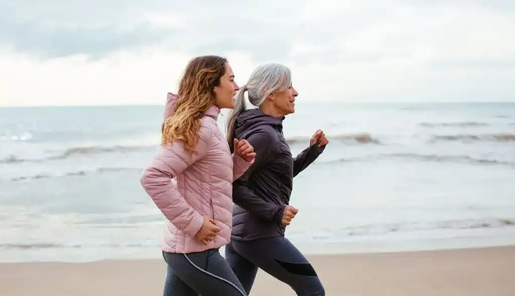 Mother-and-daughter-jogging-along-the-beach-in-light-sport-jackets-promoting-healthy-lifestyle-choices-and-cognitive-health-1024x589.jpg
