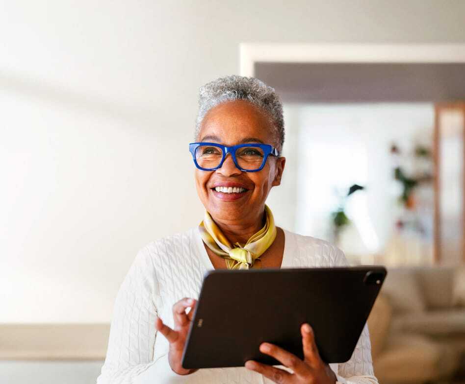 happy-mature-businesswoman-working-in-a-creative-coworking